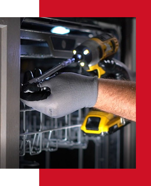 SMS Appliances repairman installing dishwasher with drill machine in Okotoks